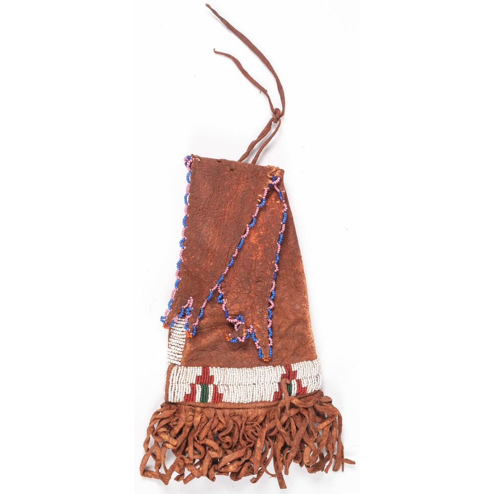 Arapaho Beaded Hide Paint Pouch, From the Stanley B.: Arapaho Beaded Hide Paint Pouch, From the Stanley B. Slocum Collection, Minnesota sinew-sewn on deer hide and beaded using colors of white, green, red white-heart, pink, orange, and periwinkle, length