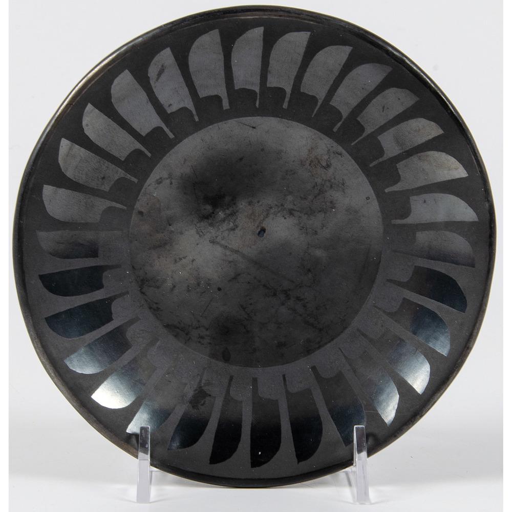 Maria and Santana Martinez (San Ildefonso, 1887-1980 /: Maria and Santana Martinez (San Ildefonso, 1887-1980 / 1909-2002) Blackware Pottery Plate with repeating feather design, signed on base; height 1 in. x diameter 5.75 in. 1943-1956
