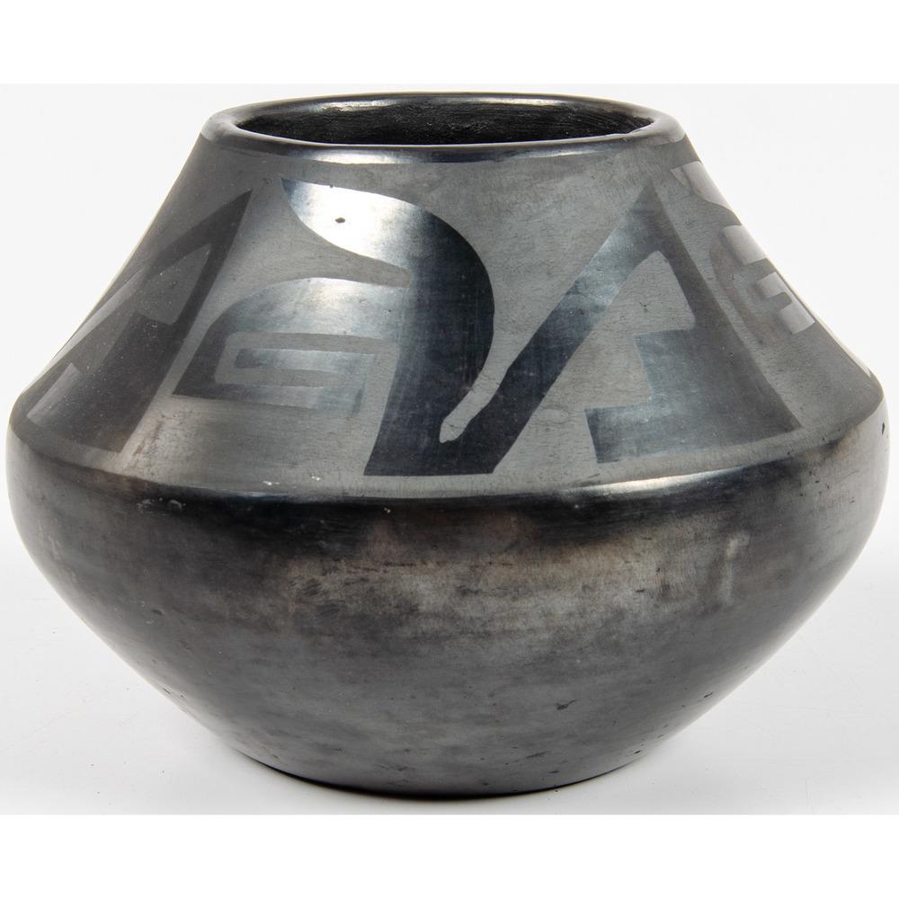 Tonita and Juan Roybal (San Ildefonso, 1892-1945/: Tonita and Juan Roybal (San Ildefonso, 1892-1945/ 1896-1990) Blackware Pottery Jar having a gun metal finish; upper portion with a meandering hooked and stepped design; signed on base, height 4.5 in.