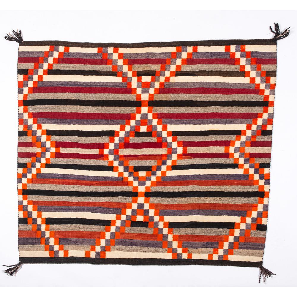 Navajo Third Phase Chief's Blanket / Rug: hand-spun wool woven with colors of orange, fugitive purple, red, gray, white, and black; traditional stepped diamond pattern, 44 x 51 in. second quarter 20th century