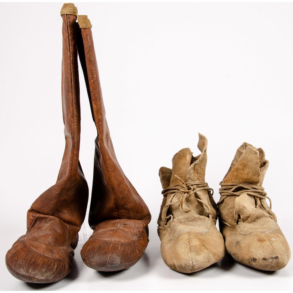 Walrus Hide Mukluks and Soft-Soled Hide Moccasins: Walrus Hide Mukluks and Soft-Soled Hide Moccasins lot of 2, includes pair of walrus hide mukluks, length 10 in. x height 17 in.; AND pair of undecorated center seam, soft-soled moccasins; constructed 