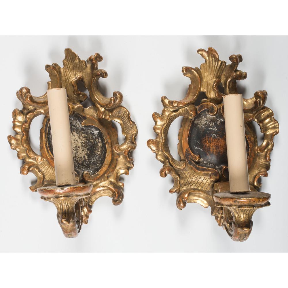 A Pair of Continental Rococo Style Giltwood Wall: A Pair of Continental Rococo Style Giltwood Wall Sconces 19th/Early 20th Century electrified. Height 11 1/2 x width 8 1/2 inches.