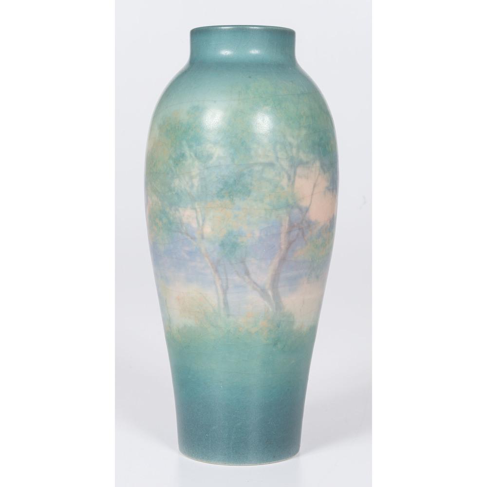 A Rookwood Pottery Scenic Vellum Vase, decorated by: A Rookwood Pottery Scenic Vellum Vase, decorated by E.T. Hurley American (Cincinnati), 1921 flame mark / XXI / 901D / V / X and artist's cypher to underside. Height 8 1/4 x diameter of base 2 1/4 inch