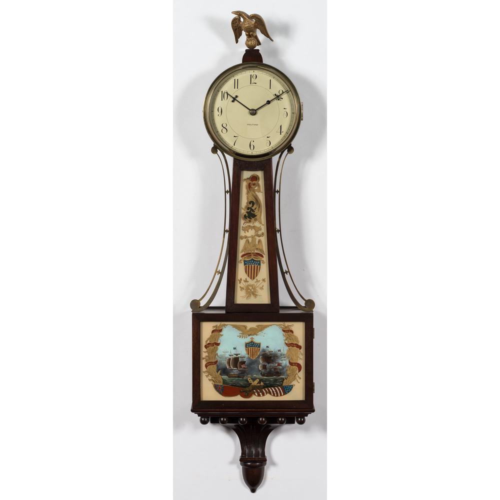 A Waltham Banjo Clock with Lake Perry's Erie Victory: A Waltham Banjo Clock with Lake Perry's Erie Victory Motif First Quarter 20th Century Height 39 x width 11 x depth 4 inches.