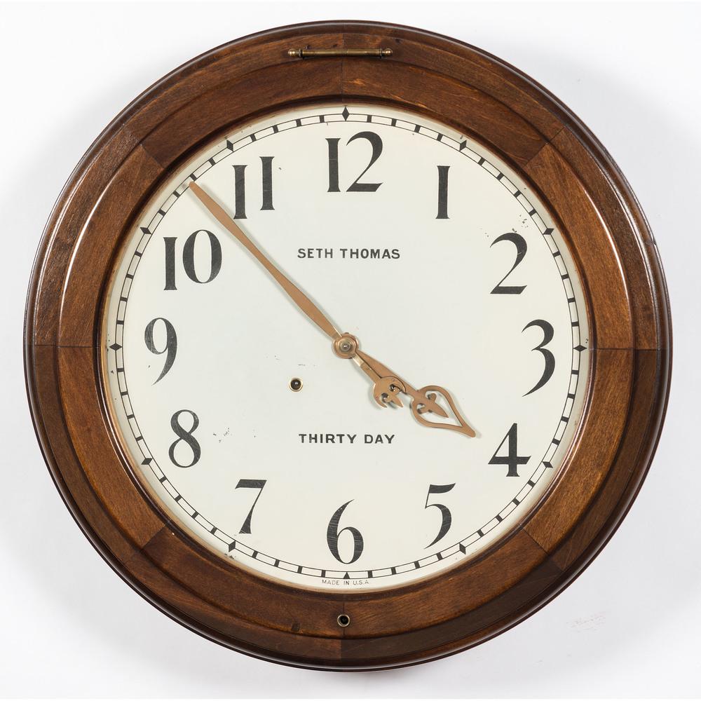 A Seth Thomas Thirty Day Gallery Clock: Early 20th Century Diameter 24 inches.