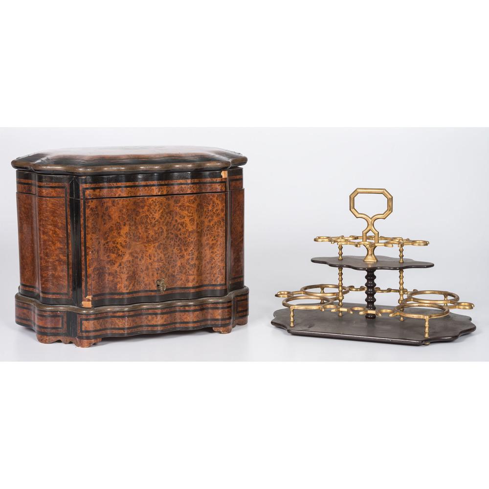 A Burlwood and Ebonized Tantulus: A Burlwood and Ebonized Tantulus 19th Century with brass mounts inside. monogrammed on lid. Height 11 x 15 1/4 x depth 11 1/2 inches.