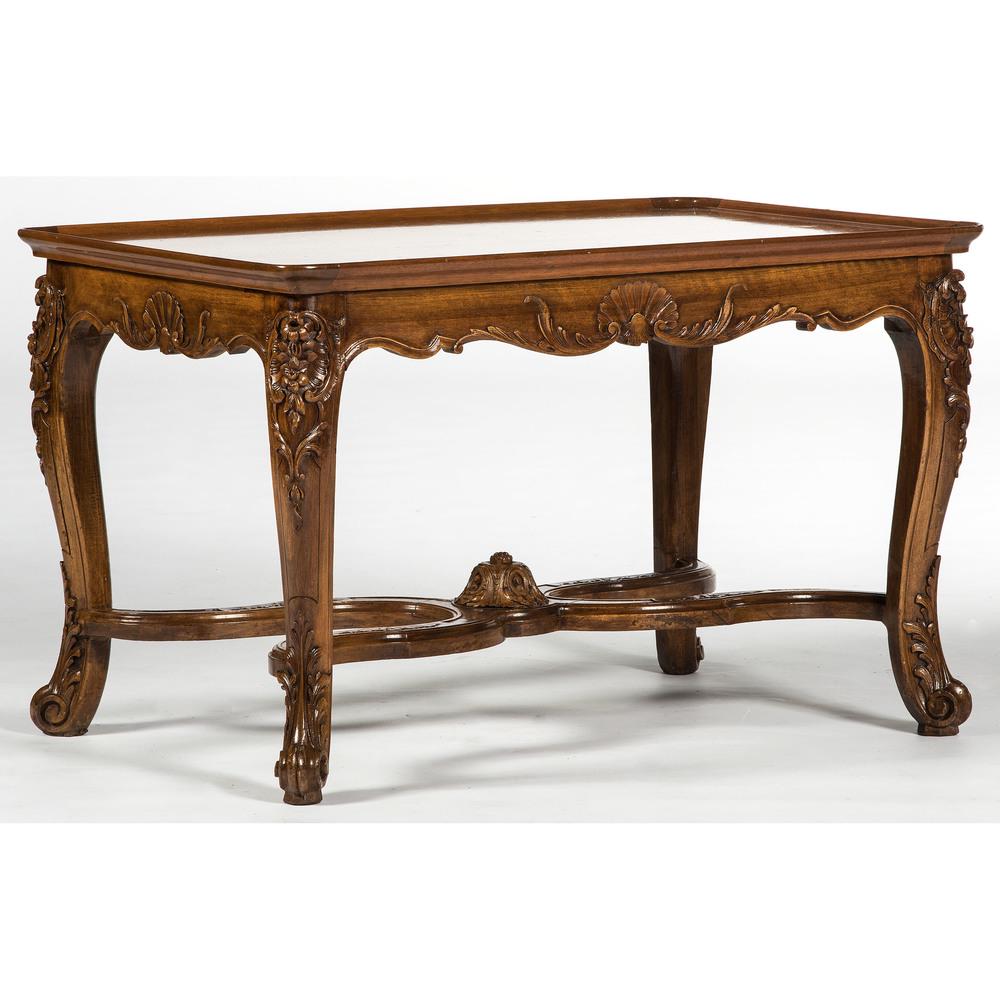 A Continental Center Table in Mahogany: A Continental Center Table in Mahogany 20th Century Height 25 x width 41 x depth 28 inches.