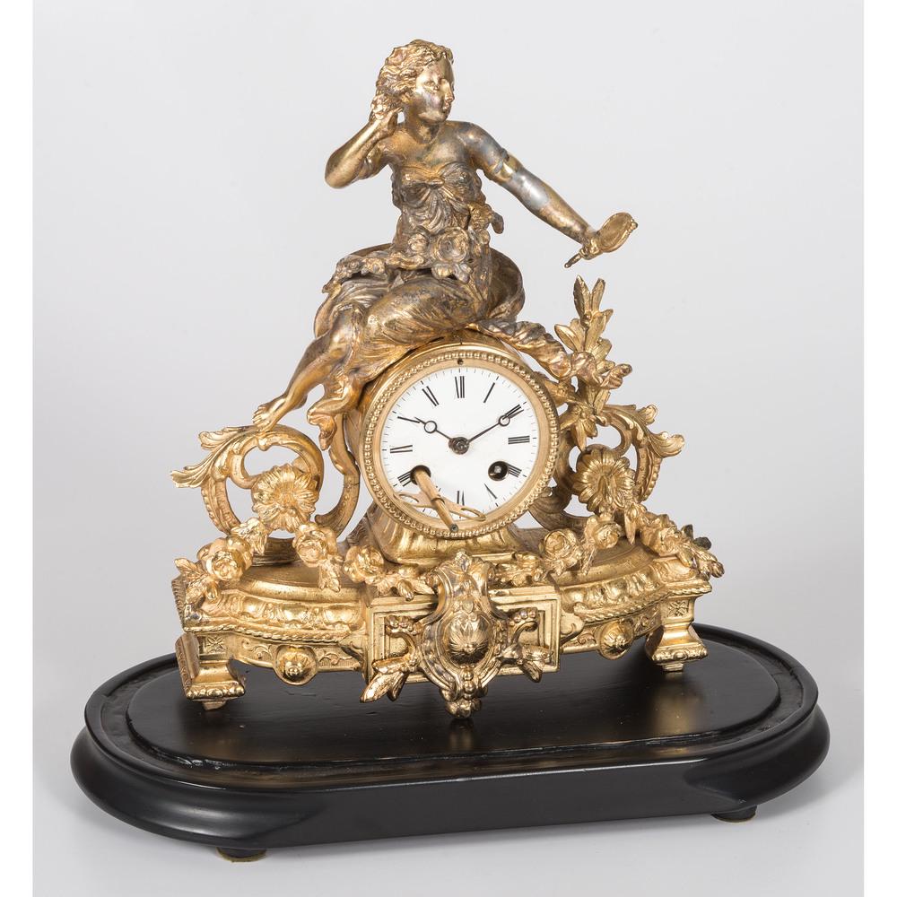 A Phillipe H. Mourey Gilt Metal Mantle Clock: A Phillipe H. Mourey Gilt Metal Mantle Clock French, 19th/20th Century stamped 2 PH Mourey 73 on back of case and numbered 608 on back of movement. with stand and dome. Height of clock 12 1/2 inches.