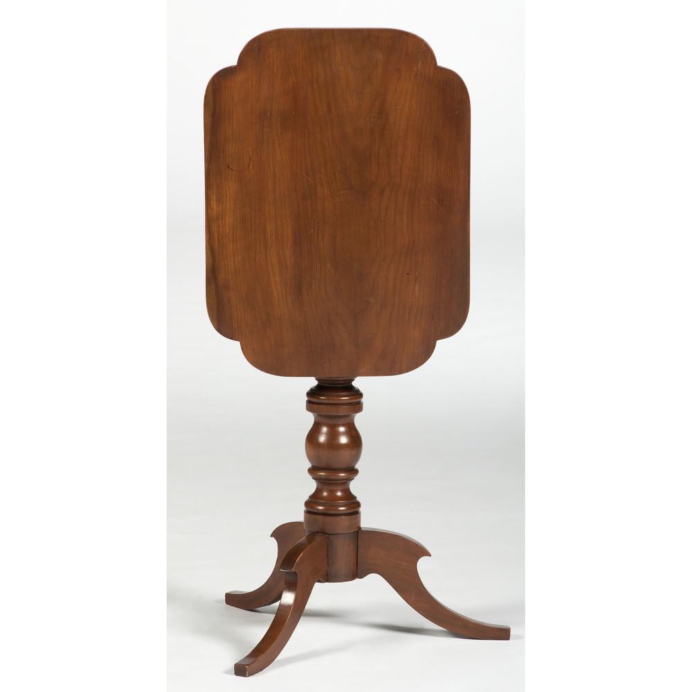 A Late Classical Tilt Top Table in Cherry: A Late Classical Tilt Top Table in Cherry American, 19th Century Height 27 1/2 x width 22 x depth 17 inches.