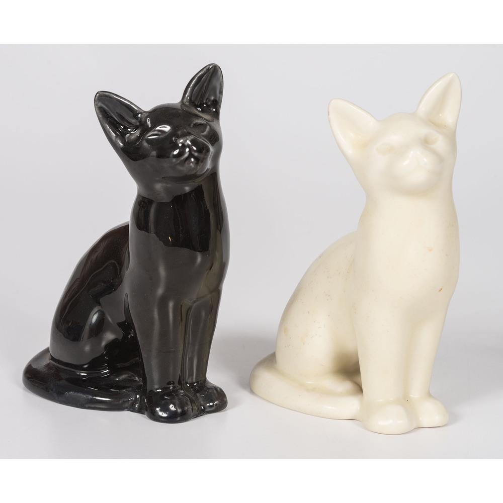 Two Rookwood Pottery Cat Paperweights: Two Rookwood Pottery Cat Paperweights 1945-49 both with factory and date mark, and pattern no. 6182. cream cat with second mark. Height 6 3/4 inches.