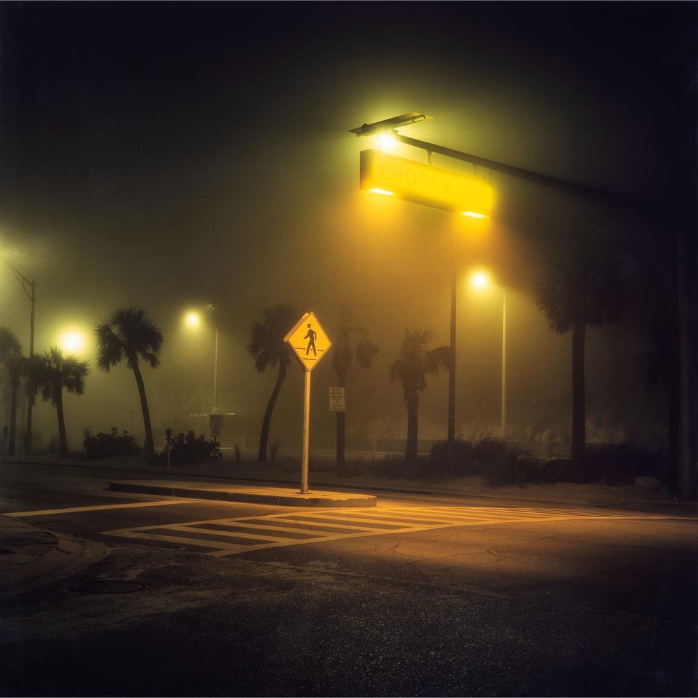Patty Carroll (American, b. 1947): Patty Carroll (American, b. 1947) Cross Walk (Clearwater Beach, Florida), 1996 Chromogenic (R-Type) Print signed in ink on verso framed sheet: 24 x 24 inches. frame: 27 x 27 inches. Provenance: