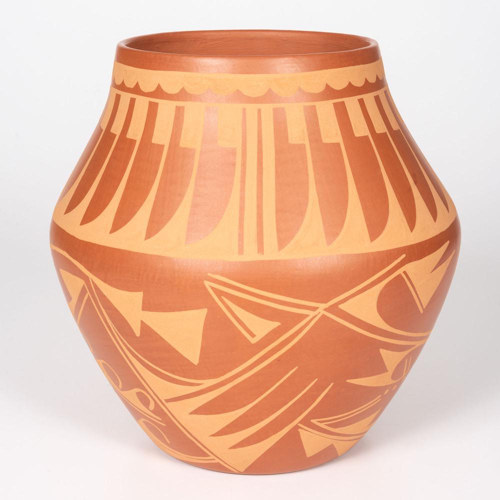 Carmelita Dunlap (San Ildefonso, 1925-1999) Micaceous: Carmelita Dunlap (San Ildefonso, 1925-1999) Micaceous Orangeware Pottery Jar with repeating feather design; height 10.25 in. x diameter 10 in., signed on base fourth quarter 20th century
