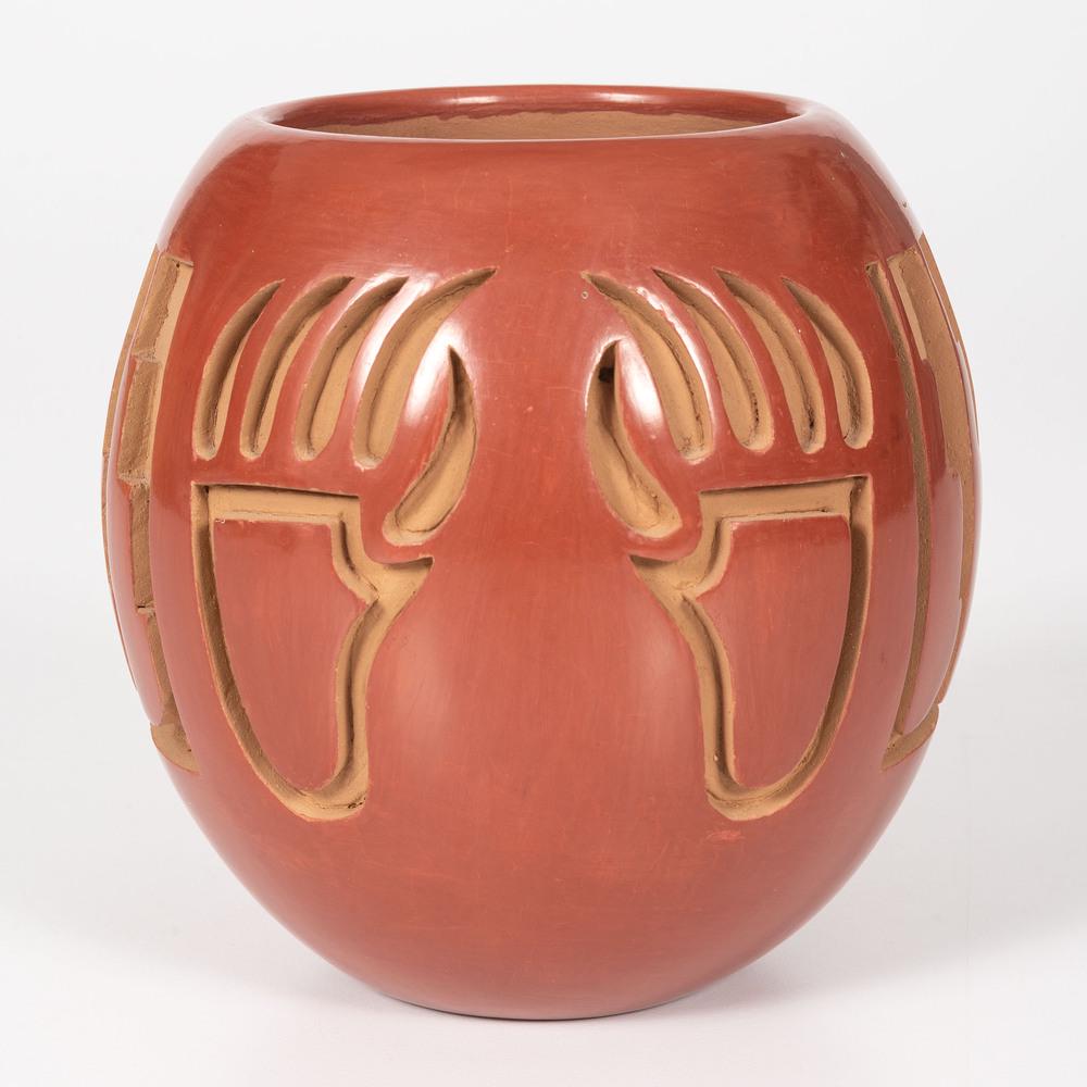 Anna Archuleta (Santa Clara, b. 1953) Pottery Jar: deeply carved and highly polished; designed with bear paws and feathers; signed on base, height 5.5 in. x diameter 5.5 in.