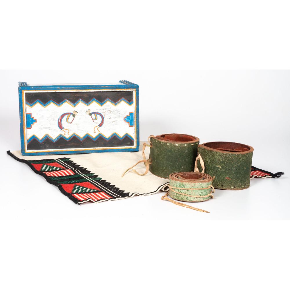 Pueblo Painted Box, with Contents *AMENDED DESCRIPTION*: box constructed with corrugated wood panels and painted with blue, orange, and white with Kokopelli figures on hinged lid; contents include pair of thick leather armbands with green pigment, belt, and