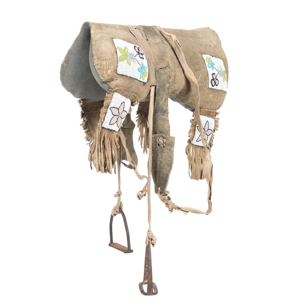 Plains Cree Beaded Hide Pad Saddle, Deaccessioned from: Plains Cree Beaded Hide Pad Saddle, Deaccessioned from the Museum of the Fur Trade, Nebraska thread-sewn on thick hide; beaded in a floral motif using large glass beads in colors of white, pea green, 