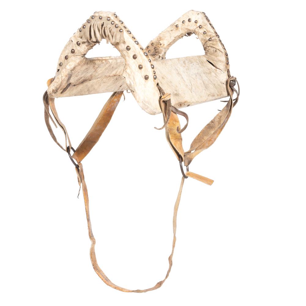 Plains Saddle, with Beaded Panel, Deaccessioned from: Plains Saddle, with Beaded Panel, Deaccessioned from the Museum of the Fur Trade, Nebraska wood frame saddle covered with raw hide and decorated with tacks, saddle length 18 in. x width 12 in.; AND th