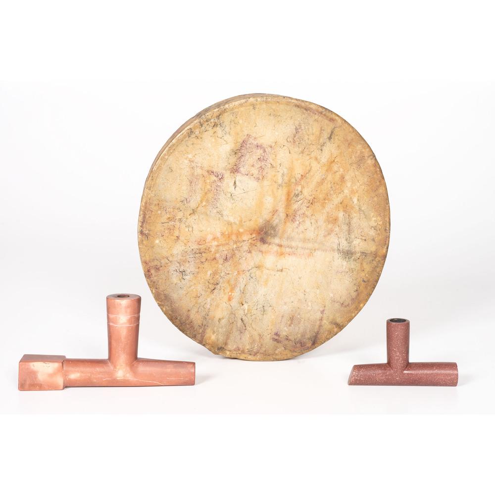 Plains Painted Drum and Catlinite Pipe Bowls: lot of 3, includes a drum with rawhide stretched over a bentwood frame; purple and red paint on exterior, diameter 11 in.; AND two T-shaped pipe bowls, lengths 6.75 in. and 4 in. late 19th century
