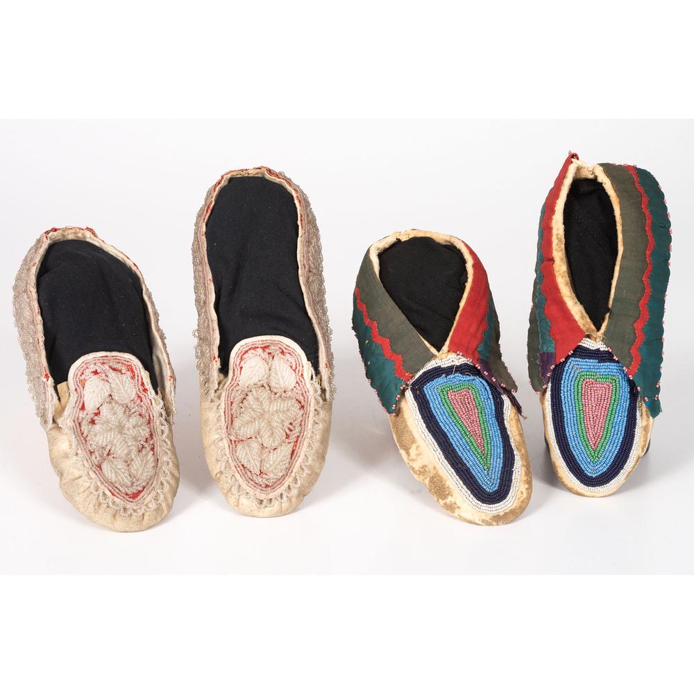 Northeastern Beaded Hide Moccasins: lot of 2, includes a Lenape pair with cuffs decorated in cotton and sateen; beaded vamps, length 7.5 in.; AND an Iroquoian pair, with heavily beaded vamps and cuffs on red wool, length 8 in. late 19th