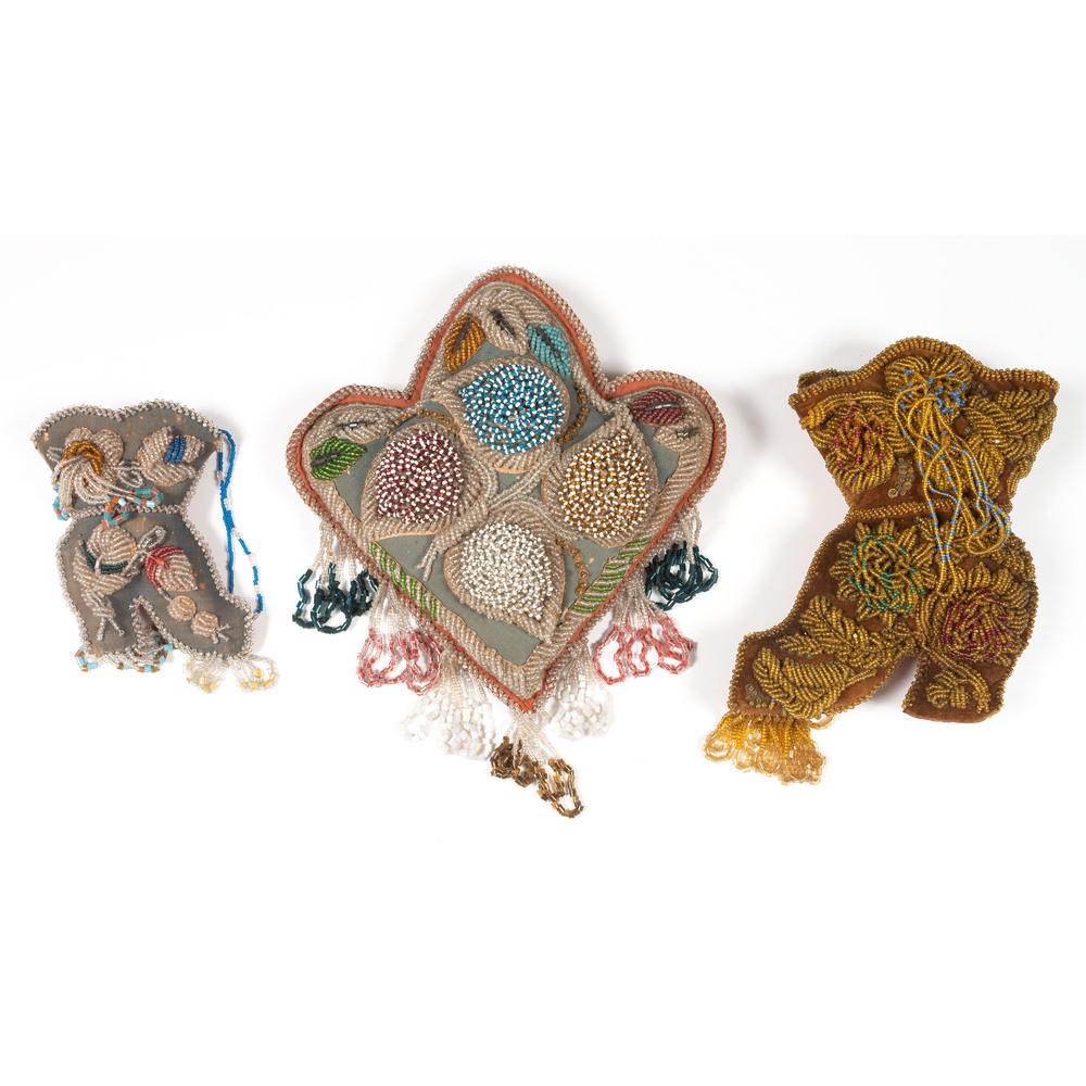 Haudenosaunee Beaded Whimsies: lot of 3, includes a large boot with amber beaded decorations, length 10.25 in. x width 7 in.; PLUS a smaller boot, length 7 in. x width 5 in.; AND a leaf-shaped pillow heavily beaded and packed with 