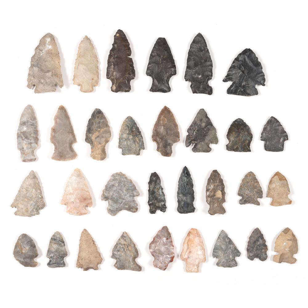 An Assortment of Flint Points: Archaic - Woodland Period, 8000 B.C. - A.D. 1200 some have been broken and glued lot of 31, longest 2-1/4 in.