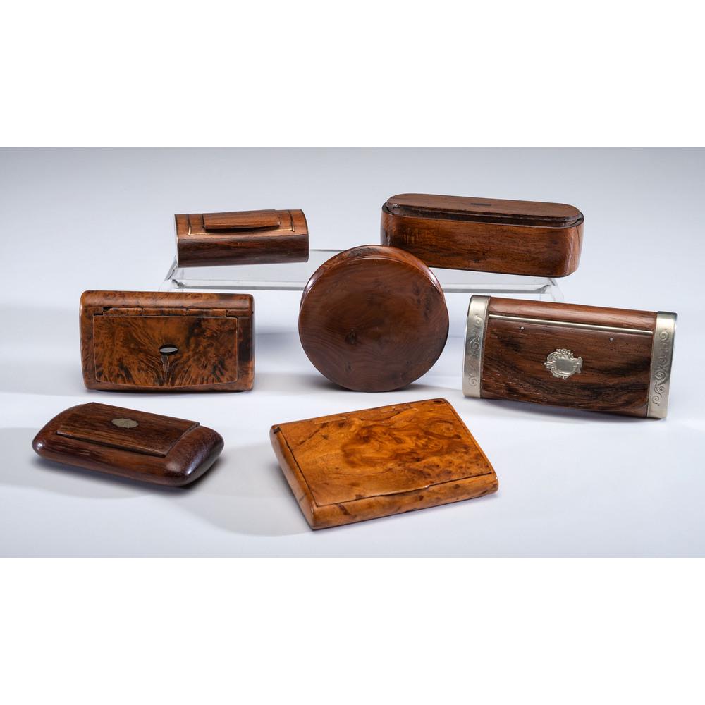 A Group of Seven Wooden and Burl Snuff Boxes: A Group of Seven Wooden and Burl Snuff Boxes 19th/20th Century including one with tortoiseshell interior and two burl examples. Length of largest 3 3/4 inches.
