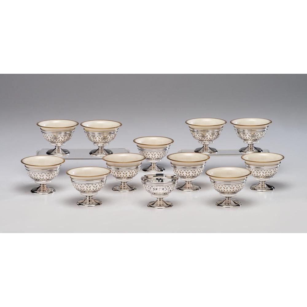 A Set of Gorham Sterling Holders with Lenox Porcelain: A Set of Gorham Sterling Holders with Lenox Porcelain Cups 20th Century twelve sterling holders and eleven porcelain cups. each piece marked. Weight of sterling 18.25ozt (567.5g). Height 2 1/2 x dia