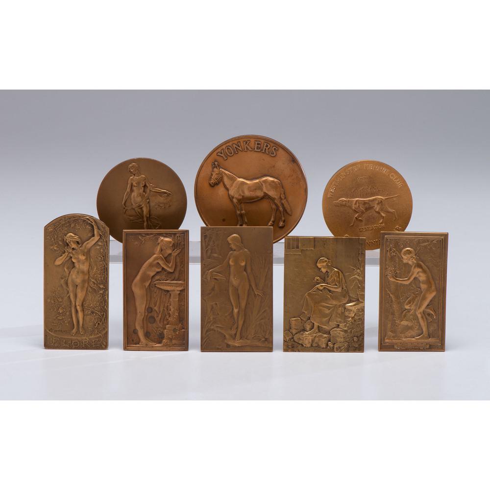 A Group of Art Nouveau Bronze Medals: A Group of Art Nouveau Bronze Medals 20th Century a group of six, two by Daniel Dupuis, two by C Loudray, one by G. Prud'homme, and one by B. Moria. along with two animal medals. Length of largest 2 7