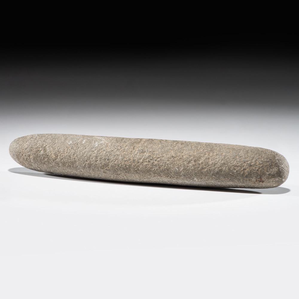 A Granite Roller Pestle, Length 12-1/2 in.: A Granite Roller Pestle, Length 12-1/2 in. Archaic Period, 8000-500 B.C. Crystal Lake, Clinton County, Michigan length 12-1/2 in. Provenance: From the Karl G. Parchert Collection, Michigan