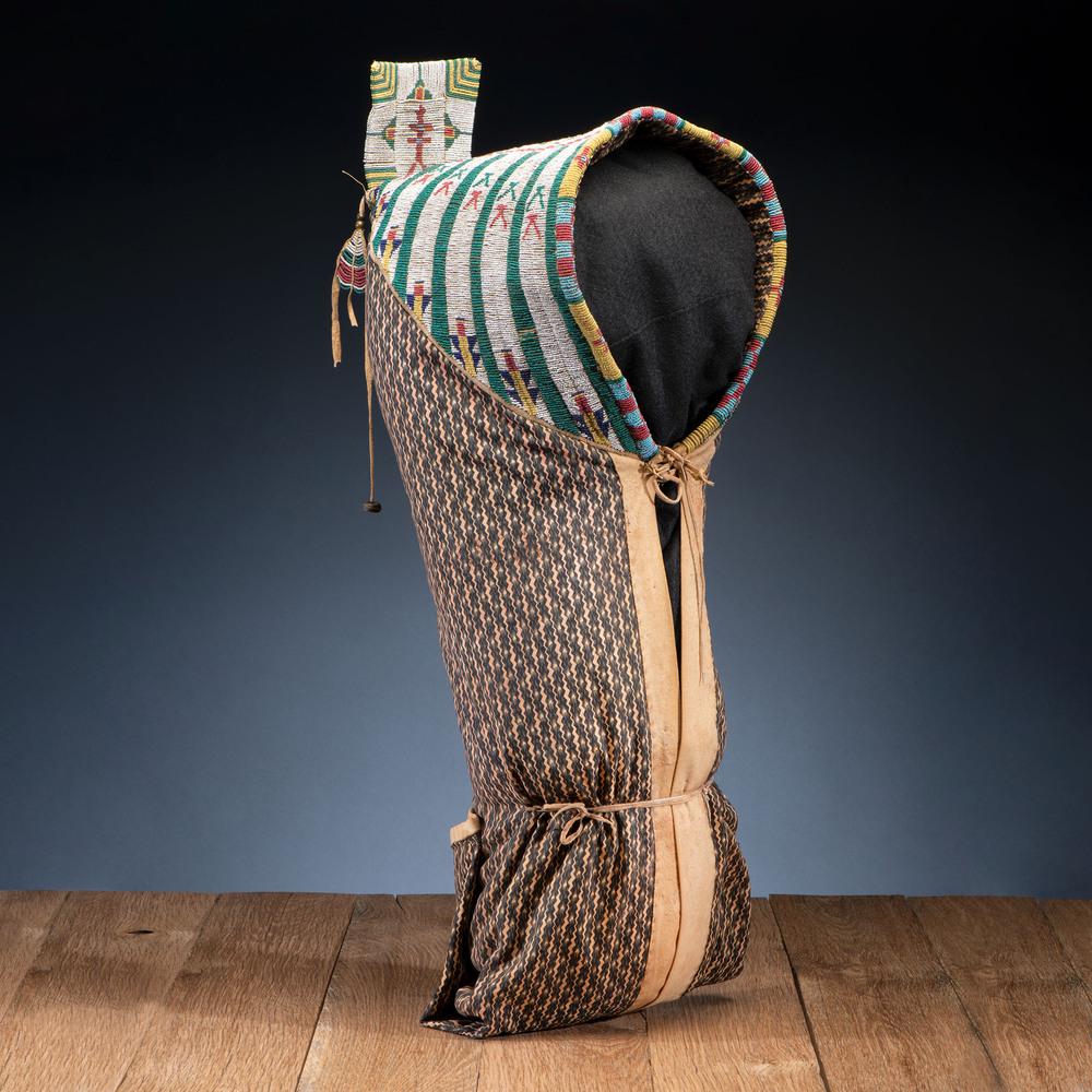 Cheyenne Beaded Soft Cradle, with Dragonflies, From the: Cheyenne Beaded Soft Cradle, with Dragonflies, From the Collection of Robert P. Jerich, Illinois sinew-sewn; with hood beaded on hide in white, translucent green, greasy yellow, red white-heart, and c