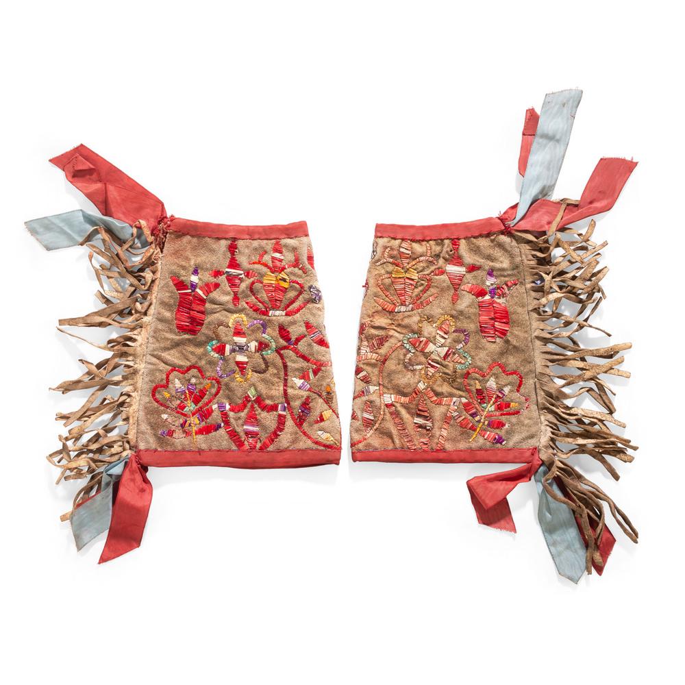 Sioux Man's Quilled Hide Cuffs, From the Stanley B.: Sioux Man's Quilled Hide Cuffs, From the Stanley B. Slocum Collection, Minnesota deer hide, with a floral motif; ribbonwork edges and fringe, length 10 in. fourth quarter 19th century Provenance: From