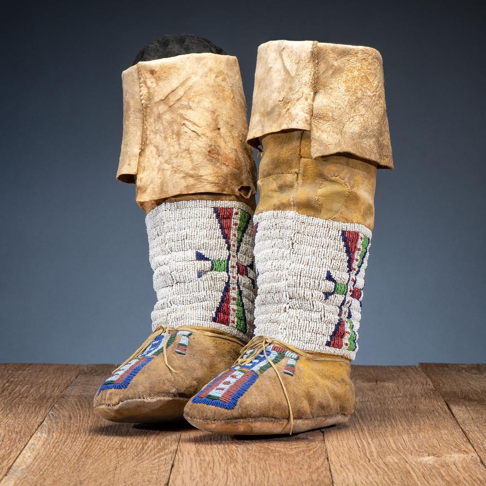 Central Plains Beaded Hide Moccasins with Leggings: Central Plains Beaded Hide Moccasins with Leggings sinew-sewn and beaded in colors of red white-heart, pea green, cobalt, dark blue, rose, amber, and translucent green; yellow pigment on moccasins; r