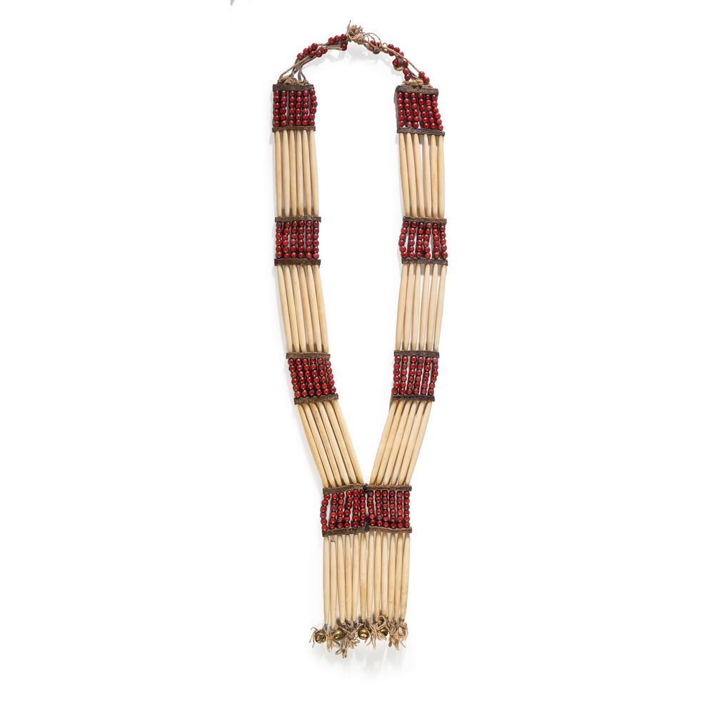 Nez Perce Woman: Nez Perce Woman's Bone Hairpipe Breastplate, From the Stanley B. Slocum Collection, Minnesota constructed using 48 bone hairpipes, large red beads with white centers, and four hawk bell drops; strung 