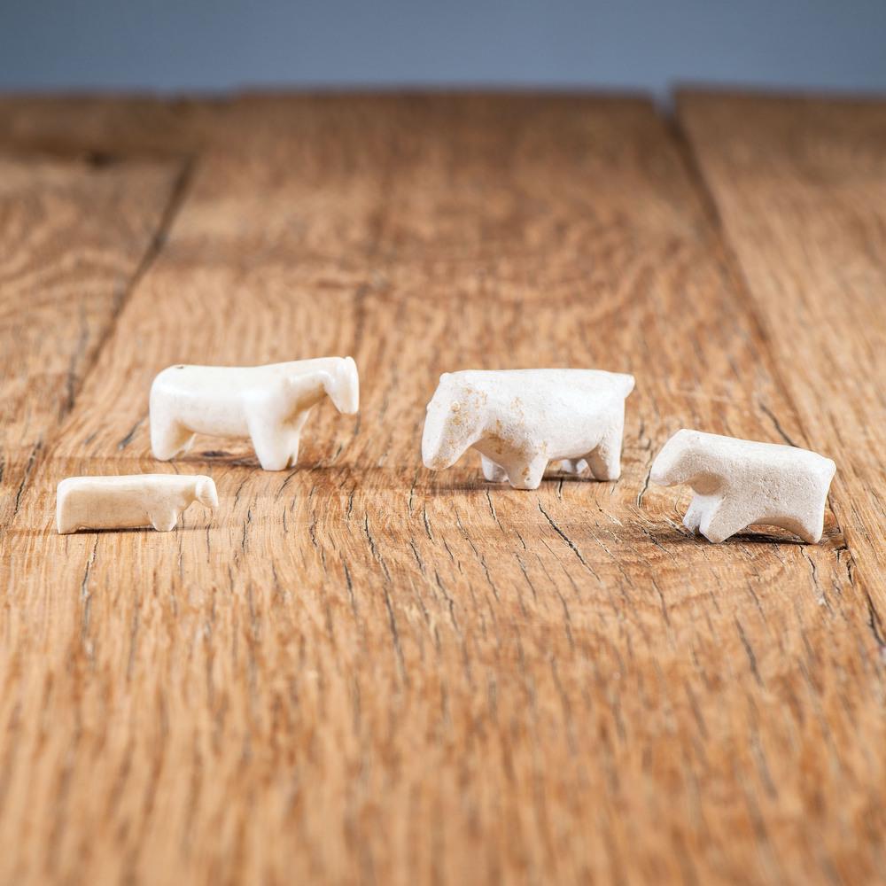 Zuni Bone and Stone Animal Fetishes, From an Estate in: Zuni Bone and Stone Animal Fetishes, From an Estate in Sinking Springs, Ohio lot of 4, possibly depicting horses, bear, and/or sheep; largest height 0.75 in. x length 1.5 in. and smallest height 0.25 