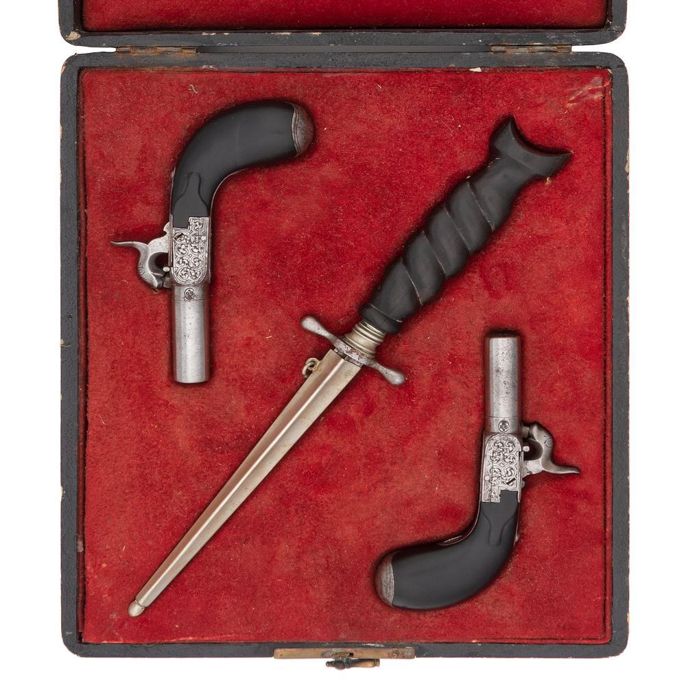 Cased Pair of Belgian Single Shot Percussion Pistols: .36 caliber, 1.25" barrel, no S/N. Steel finish with one-piece ebony grips. Folding triggers with threaded barrels. Engraved throughout with floral sprays. Red velvet-lined case complete with matc