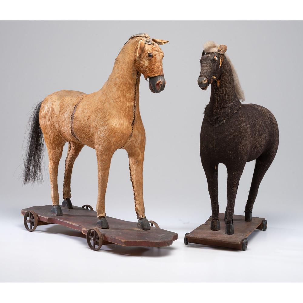 Two Horse Pull Toys: 19th Century in various materials. Height of taller 21 inches. Provenance: Property from the Estate of Joan Conway Crancer, St. Louis, Missouri