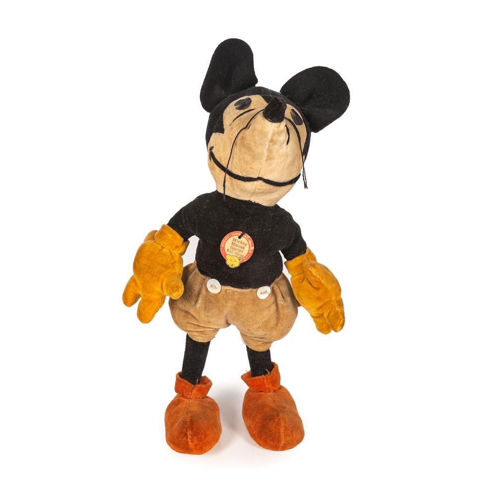 A Steiff Mickey Mouse Doll: Circa 1930s with original cardboard tag and Walt Disney stamp on underside of foot. Height 9 inches.