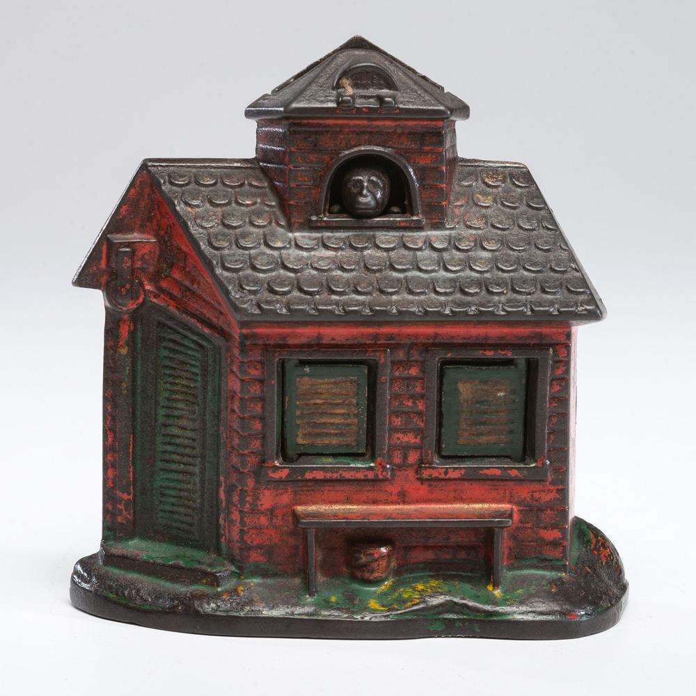 A Cast Iron Mechanical Zoo Bank: American, Late 19th Century manufactured by Kyser & Rex. marked "Zoo" / Bank / Press the Monkey / 134 on back. Height 4 x width 4 1/2 inches.