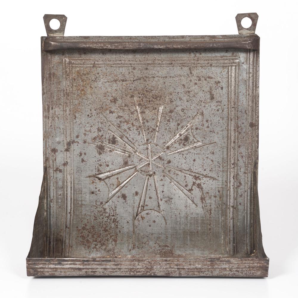 A Tin Hanging Candle Shelf with Star Decoration: American, 19th Century Height 15 x width 14 x depth 5 inches. Provenance: Property from the Collection of Judith & Gary Gay, Morrow, Ohio