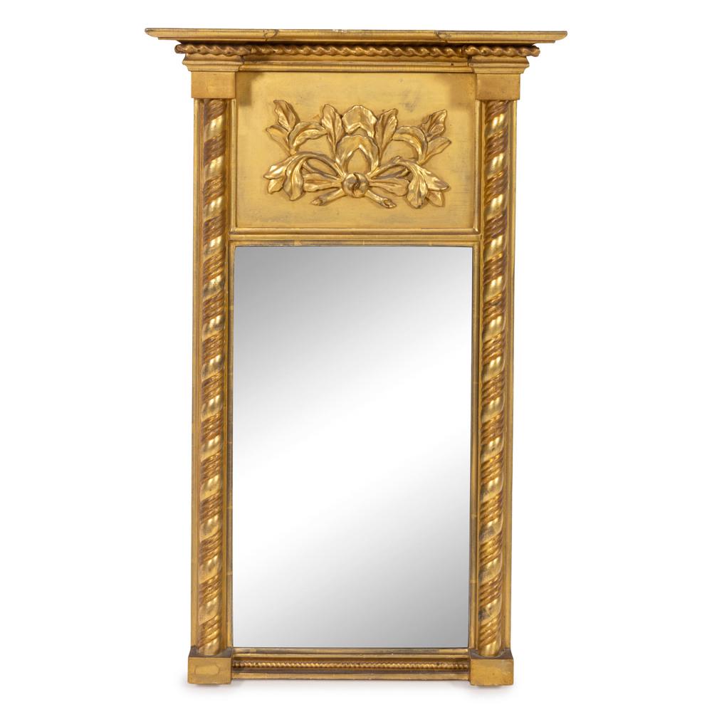 A Classical Carved Giltwood Looking Glass: New England, Circa 1815 Height 31 1/4 x width 19 1/2 inches. Provenance: Property from the Collection of Michael and Janice Doniger, Chicago, Illinois Jeffrey Tillou Antiques, Litchfield, Connecticut