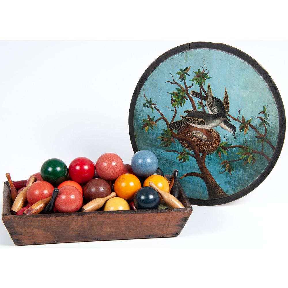 A Polychrome Painted Barrel Lid & A Wooden Tray: 19th/20th Century including a group of billiard balls and skittle pens. Diameter of lid 12 1/4 inches. Height of tray 2 1/2 x length 13 x depth 8 inches. Provenance: Property of the Estate of Jack Bat