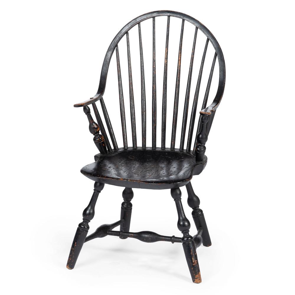 A Black-Painted Continuous-Arm Windsor Armchair: New England, 19th Century Height 34 1/2 inches.
