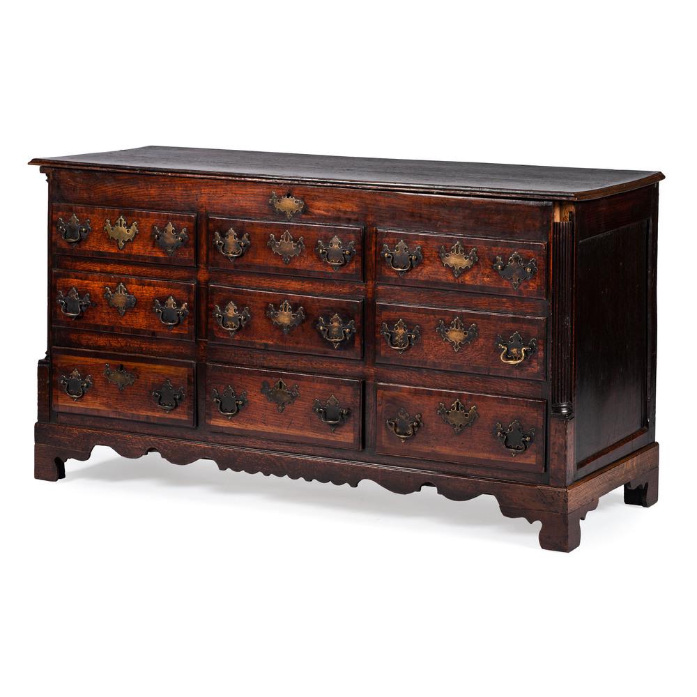 An English Chippendale Oak Dower Chest: 18th Century with six faux drawers. Height 34 x width 61 1/4 x depth 21 inches.