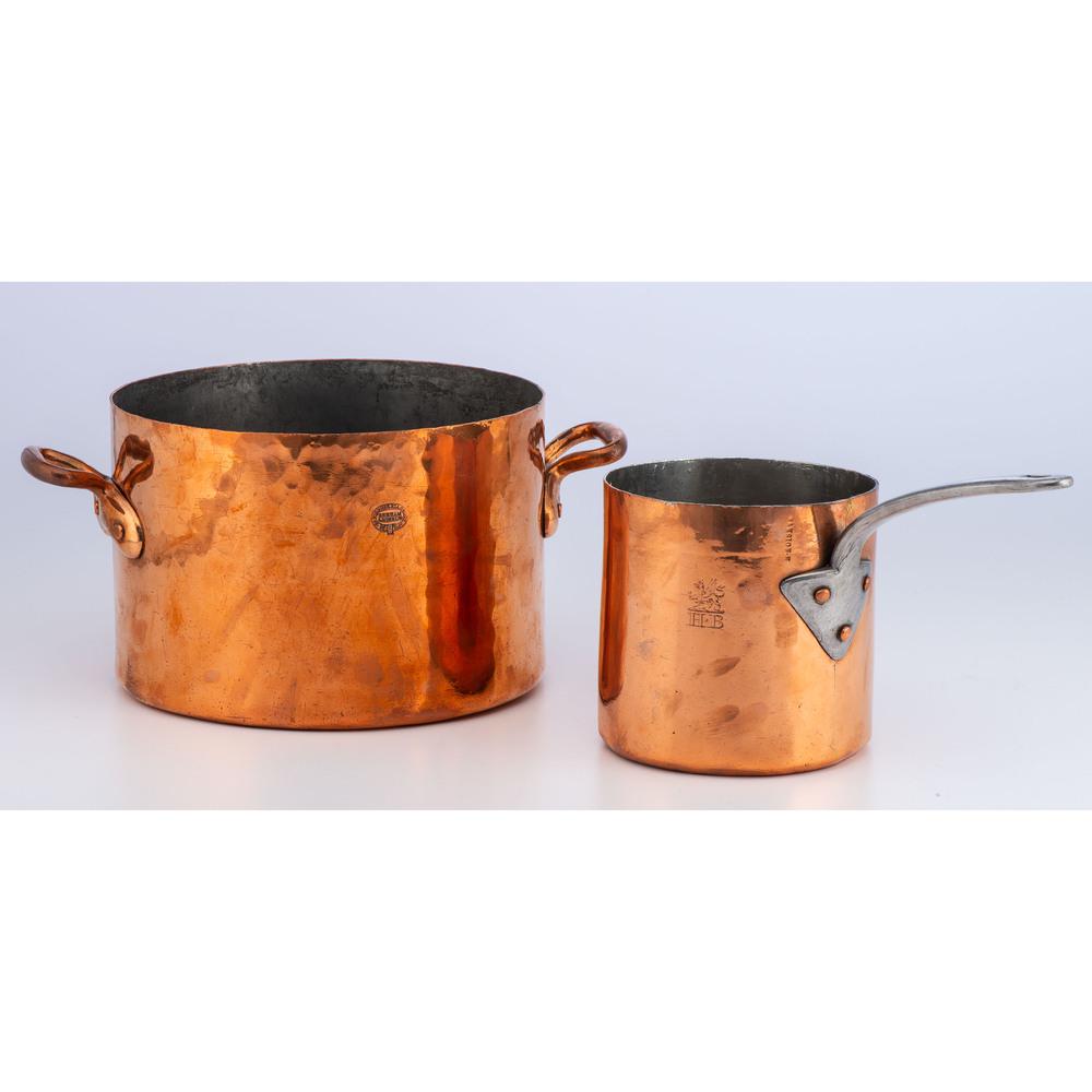 Two English Copper Pots, One by Benham & Sons: 19th Century a dovetailed copper stock pot signed Benham & Sons 66 Wigmore St. London and a dovetailed sauce pot marked Mansion. H and with heraldic engraving. Height of Benham pot 8 x diameter 12 inc