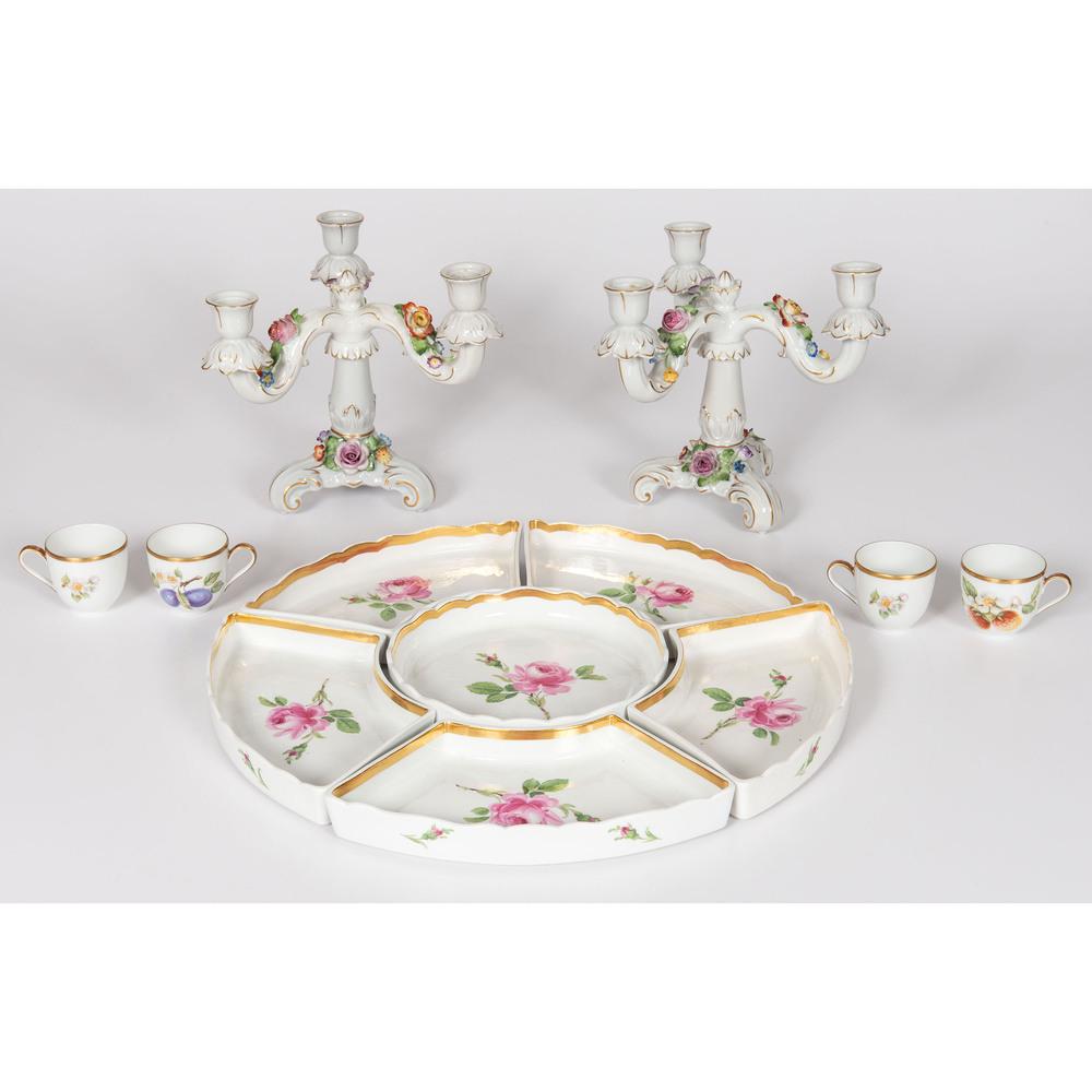 A Group of German Porcelain Tableware Including Meissen: 20th Century includes a Meissen lazy Susan set with floral decoration, a pair of Von Schierholz three-branch candelabra, and a Hutschenreuther set of four demitasses. all marked. Height of candelabra�