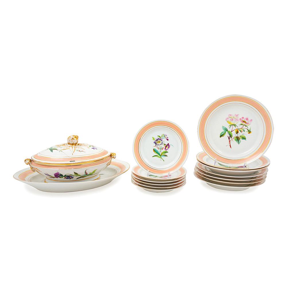 A Continental Porcelain Partial Dinner Service: fifteen items total, comprising a tureen with an underplate and thirteen plates in two sizes. Width of tureen 12 inches.