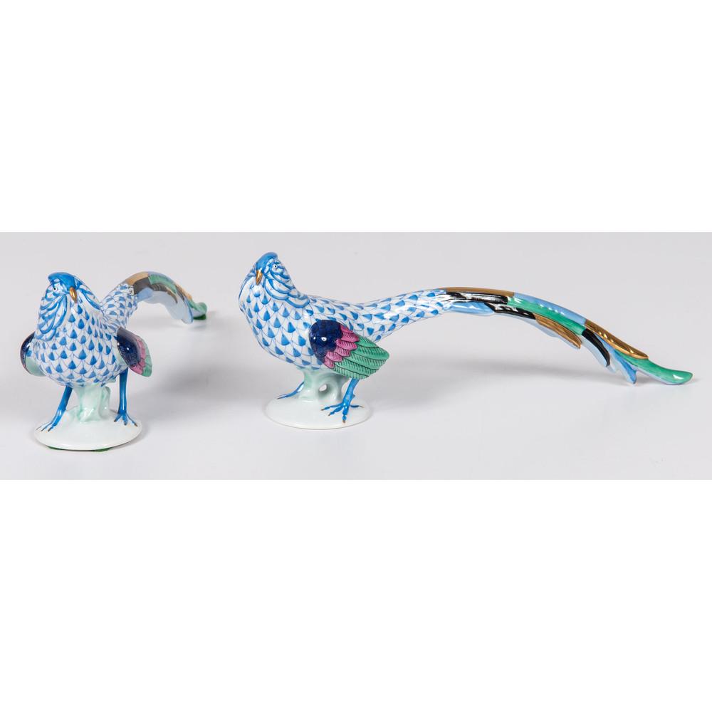A Pair of Herend Porcelain Pheasants: Continental, 20th Century each with blue Herend mark on underside. Height 3 x length 9 inches.