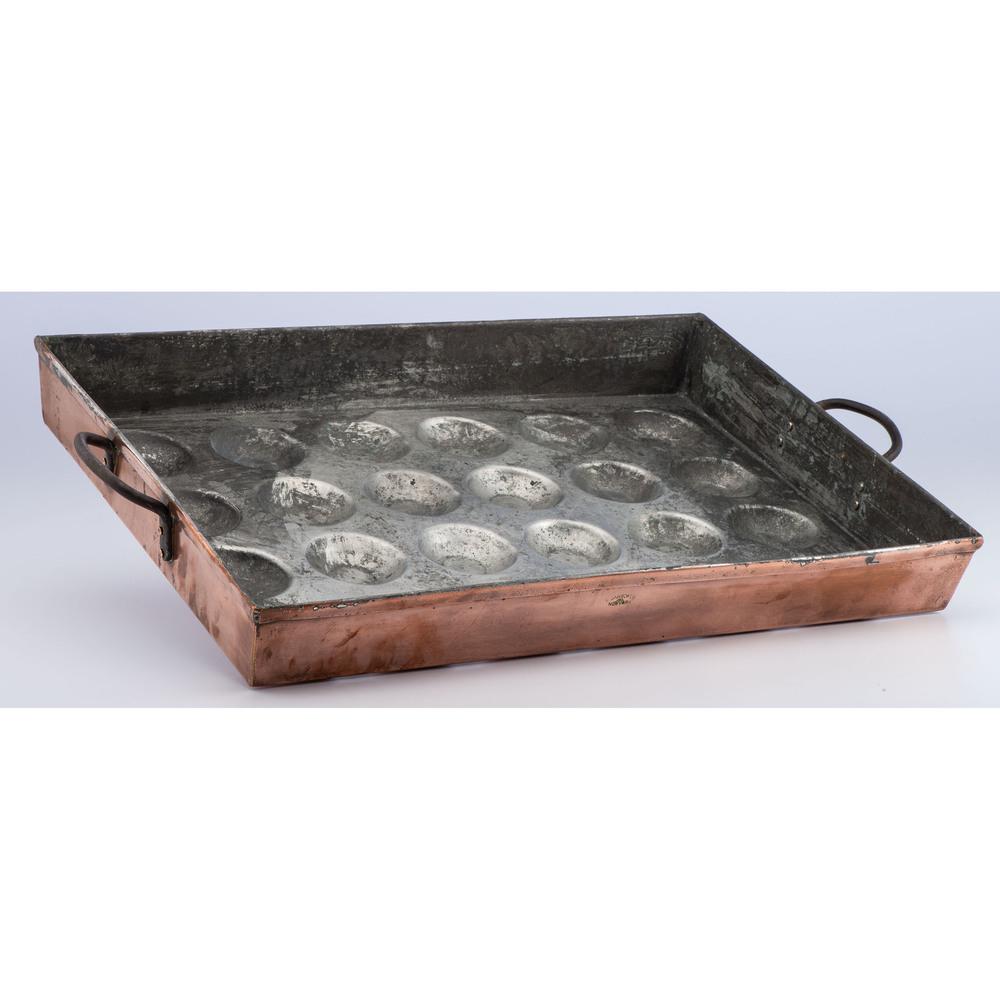 A New York Copper Muffin Pan: Early 20th Century signed H. Barrow Co. / Inc. / New York. Height 3 x length 25 1/2 x width 8 inches. Provenance: Property from the Collection of Darryl Lippman