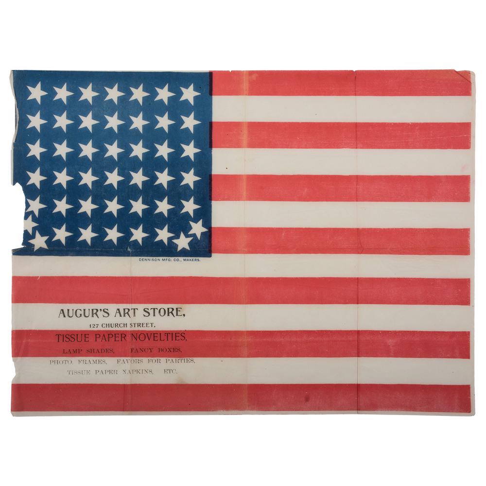 44-Star Augur Advertising American Flag: Advertising flag printed on tissue paper, 13 x 17.5 in. Unique star pattern. Notation “Dennison Mfg. Co., Makers” printed on white stripe below canton. Overprint: "Augur’s Art Store / 127 Church