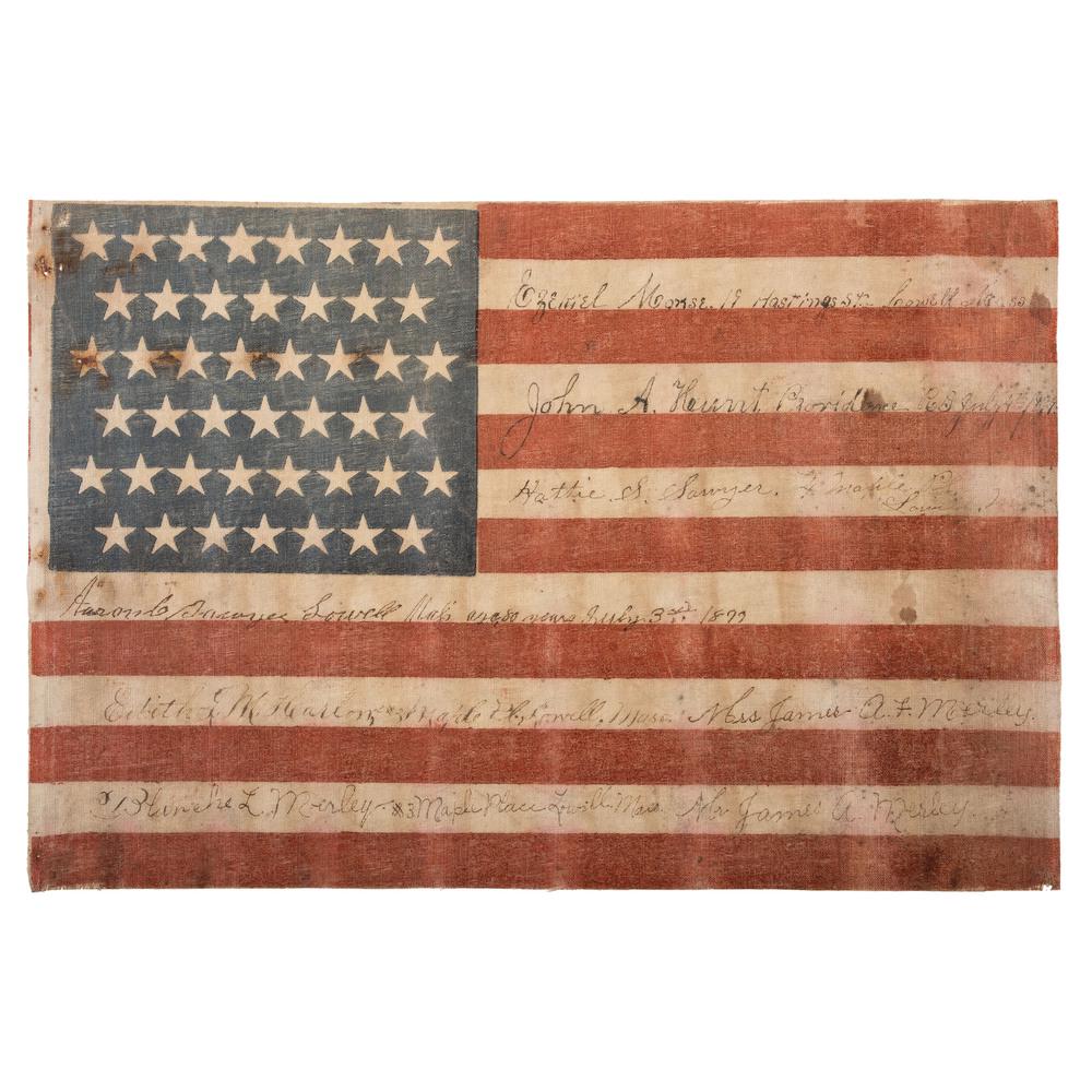 45-Star Lowell, Massachusetts, Signed American Flag: Printed flag on cotton, 11.75 x 17.5 in. Staggered pattern. Handwritten notations: "Ezekiel Morse 19 Hastings St. Lowell, Mass. / John A. Hunt Providence RI July 4th, 1899 / Hattie S. Sawyer #4 Maple 