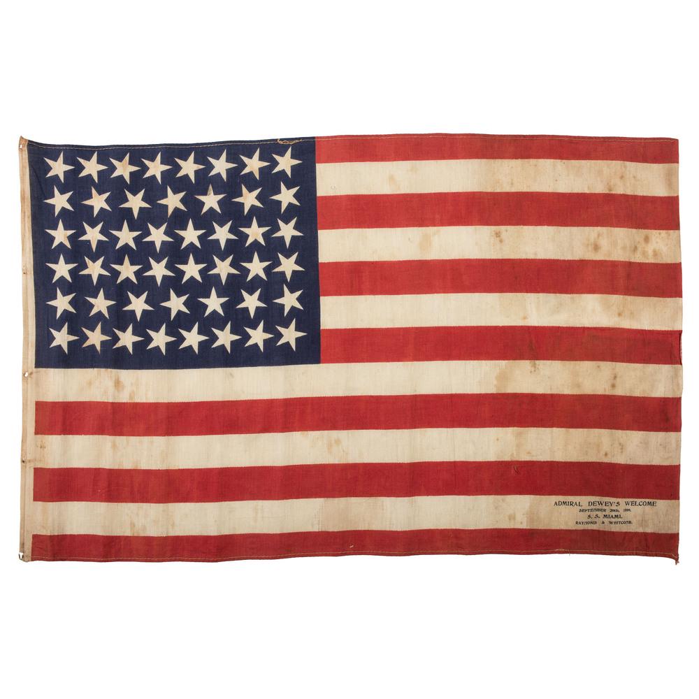 46-Star Admiral Dewey Flag: Printed flag on cotton, 14.5 x 23 in. Inscription: "Admiral Dewey’s Welcome September 29th 1899 SS Miami Raymond & Whitcomb." Ca 1899. George Dewey graduated from the Naval Academy in 1858 and serve